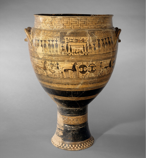 Ancient Greek ceramic krater with intricate geometric patterns and scenes of figures and chariots. Two handles on sides, earthy tones.
