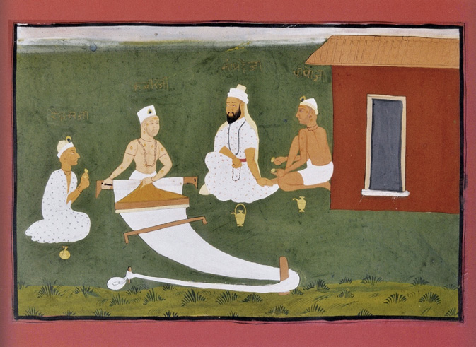 Four figures in white robes sit on grass. One works on a loom. A red building is in the background.